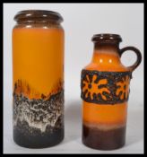 A vintage retro 20th century West German fat lava stick stand together with a West German ceramic