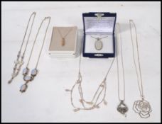 A selection of 925 silver pendant necklaces, some
