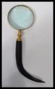 A good quality mid century gentleman's desk top magnifying glass having circular glass set to a