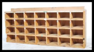 A vintage mid 20th century scratch built pine wall hanging pigeon hole. Measures 54cm x 123cm x