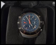A vintage Breitling gents 40mm cased wrist watch set to a black leather strap. blue dial with gilt