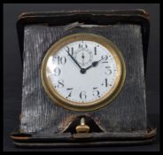 An early 20th century / Victorian travelling leather cased pocket watch clock having a white