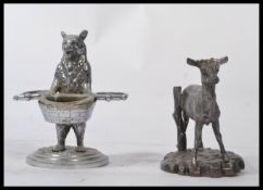 A cast silver white metal figurine of a deer faun , along with a standing bear condiment holder on