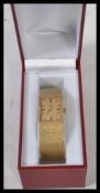 An Omega Watch Company 14 carat gold gents 22mm bracelet mechanical watch having a square gilt