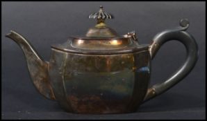 A silver hallmarked teapot for Chester 1939, makers marks illegible. The teapot with ebonised