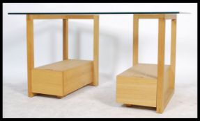 A contemporary Habitat glass and oak twin pedestal desk, the open framed pedestals each fitted
