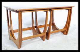 A retro teak wood 20th century G - Plan nest of three occasional side tables being raised on squared