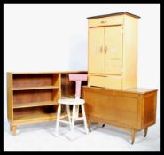 A collection of retro 20th century furniture to include a blanket box, bookshelf, free standing