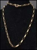 A 9 carat gold  hallmarked elongated curb link necklace chain having bolt ring clasp. Weighs 4.6