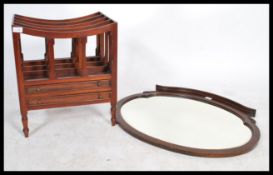 A vintage Regency style mahogany Canterbury with slatted divisions and frieze drawers, on turned