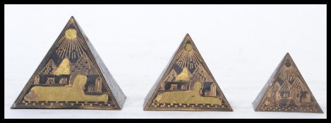 A set of three graduating early to mid 20th century Grand tour souvenir Pyramids, each decorated