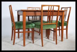 Gordon Russell of Broadway - A 1960's Teak wood extending table raised on square tapered legs and