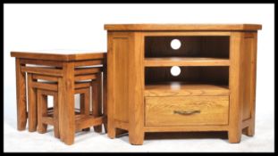 A contemporary oak chunky nest of tables of simple form together with a matching corner cabinet - tv