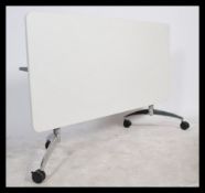 A contemporary design Senator S21 folding flight table - dining table. Raised on chrome legs with