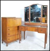A mid 20th century Neil Morris for Morris of Glasgow bedroom suite in walnut comprising a good