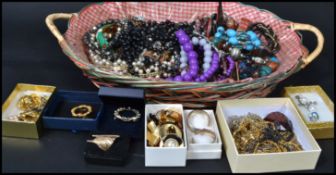 A collection of costume jewellery to include beaded necklaces, brooches, watches, earrings etc