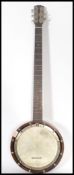 An early 20th century 4 string banjo musical instr