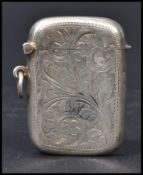 A silver hallmarked match Vesta case having a fitted hinged lid, chase decorated with foliate design