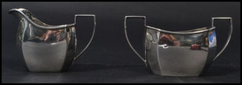 A silver hallmarked matching creamer and sugar bowl. Hallmarked for S. Blanckensee & Son Ltd,