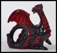 A Royal Doulton Flambé figure 
