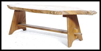 A retro 20th century live edge coffee table the full grain show wood surf board shape top raised