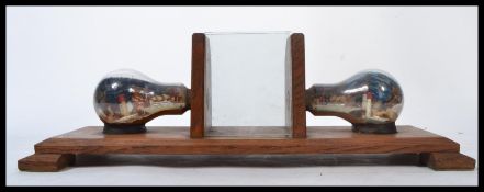 A stunning scratch-built 20th century Art Deco desk top oak picture frame the central frame