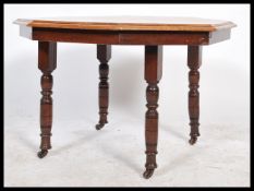 A vintage 20th century Edwardian mahogany octagonal low occasional / coffee table raised on turned