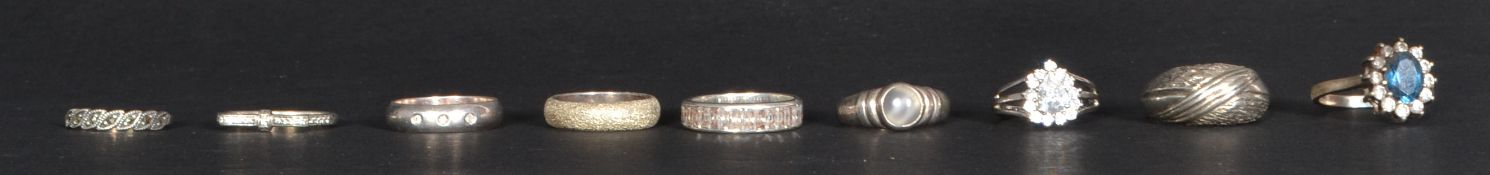 A group of nine sterling silver dress rings. Weighs 34 grams. Please see images.