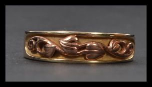 A 9ct gold hallmarked Welsh gold ( Clogau ) ring, rose gold overlay stylised design and retaining