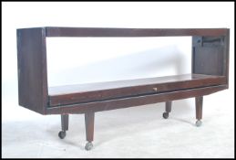 A large mid century teak wood open sideboard - serving table trolley being of long rectangular