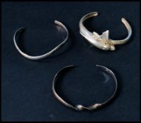 A selection of three 925 silver bangles to include