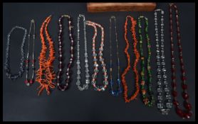 A collection of vintage 20th century necklaces to include coral , Art Deco , Czech filigree , end of