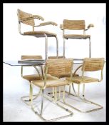 After Marcel Breuer - A mid 20th century gilt chromed tubular metal and smoked glass dining room