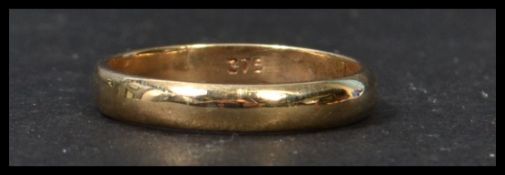 A 9ct gold ladies band ring of simple form being stamped 375 to the inner shank. Weight 2.7g