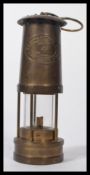 A vintage 20th century miners lamp made by E Thomas & Williams Aberdale. Cambrian No.6911.