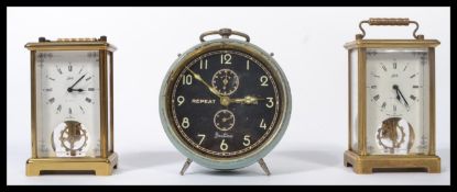 A pair of 20th century key wind brass carriage clocks by Shatz together with a vintage alarm clock
