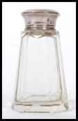 An early 20th century silver hallmarked topped sugar caster / sifter having a faceted cut glass body