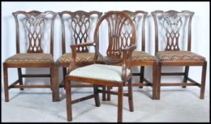 A set of 4 19th century Georgian mahogany chippendale revival dining chairs. Raised on squared