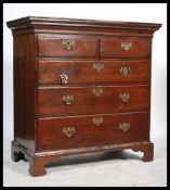 A 19th century Georgian mahogany chest of drawers raised on ogee bracket feet with a series of short