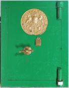 An early 20th century heavy cast metal safe in the original green painted finish having decorative