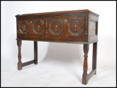 An 18th century oak Jacobean revival dresser base side cabinet being converted to a gramaphone