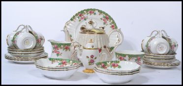 A 20th century novelty bone China Royal Albert Country Roses teapot together with a bone China tea