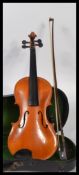 A Continental violin 3/4 sized  with bow and case, marked Stainer to the verso