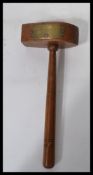 A vintage early 20th century turned wood gavel with brass plaque reading Presented to Bro F.R.Cox