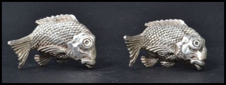 A pair of silver hallmarked continental paperweights in the form of fish, possibly Bream. Both