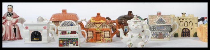 A good collection of vintage ceramic novelty teapots to include , Sadler , Tony Wod etc. Please