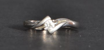 An 18ct white gold single stone diamond ring of approx 10pts. Size P weighs 2.4 grams.