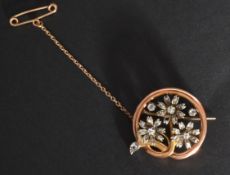 A yellow metal tests as 18 ct gold diamond brooch. Weighs 10.22 grams.