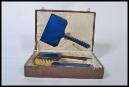 A vintage 20th century cased Blue Guilloche enamel  vanity set comprising mirrors and brushes etc.