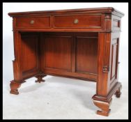 A 20th century antique style mahogany writing table / desk, green tooled leather scribe to the top